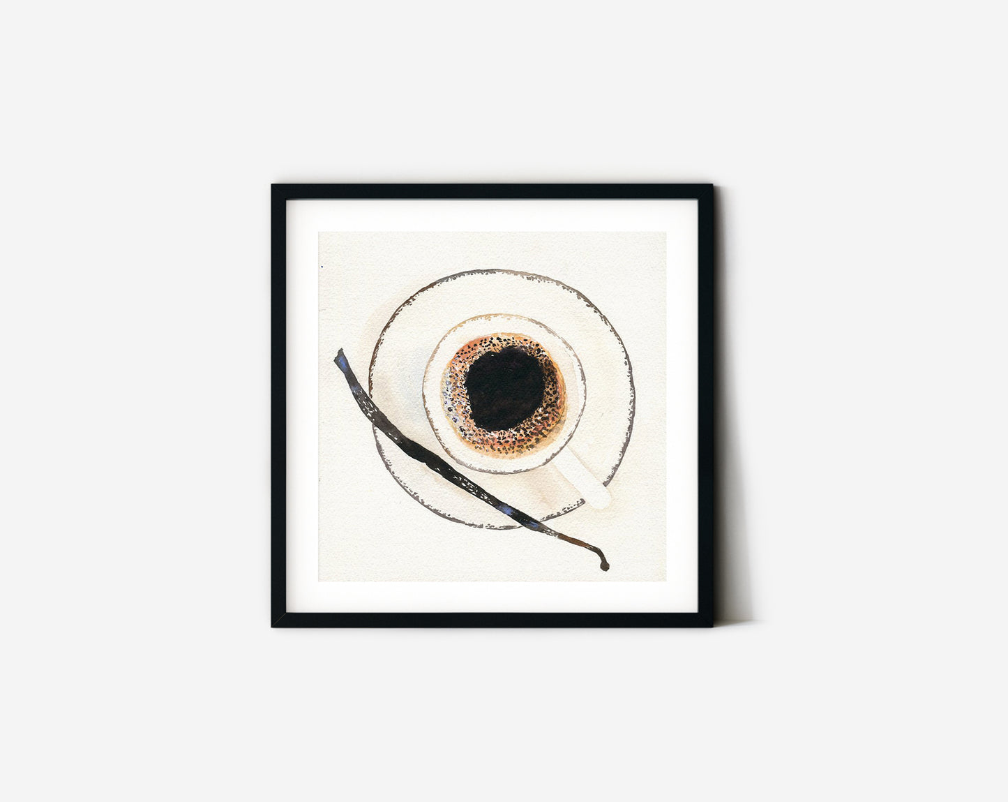 Coffee cup from above with vanilla stick